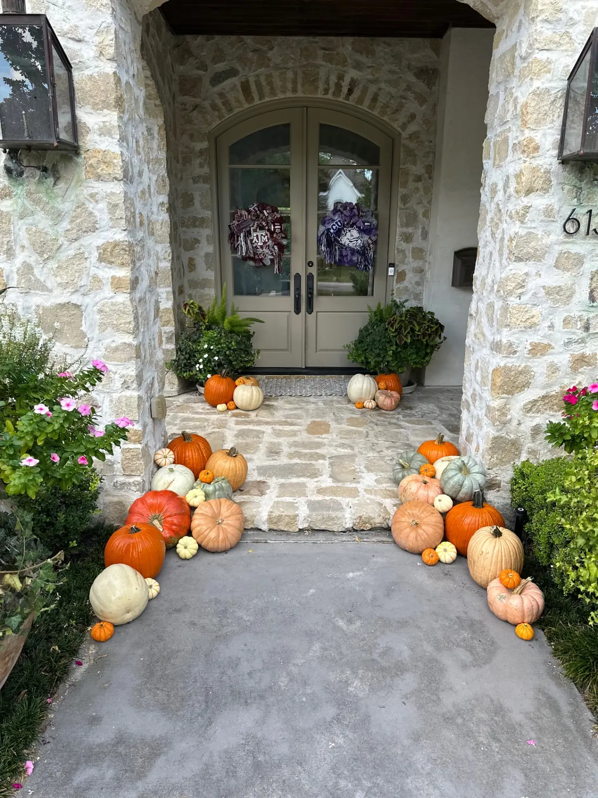 Stone entry walkway framed with heirloom pumpkins, styled by West Pumpkin Bros